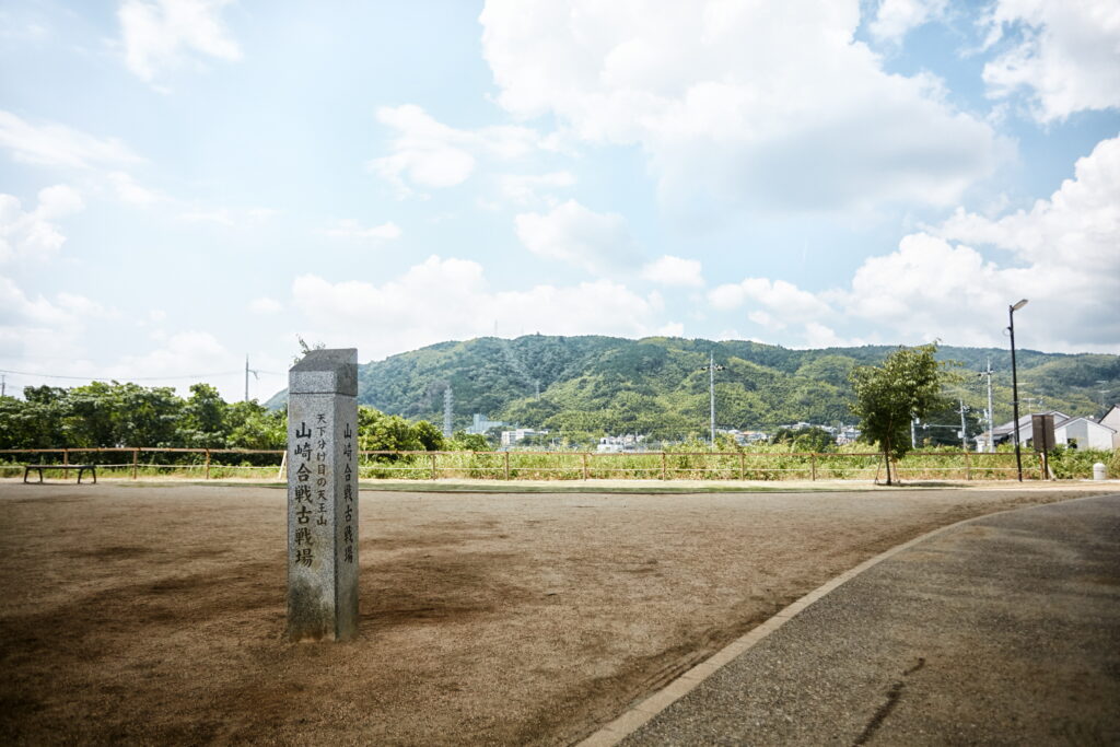 A stone marker by a road