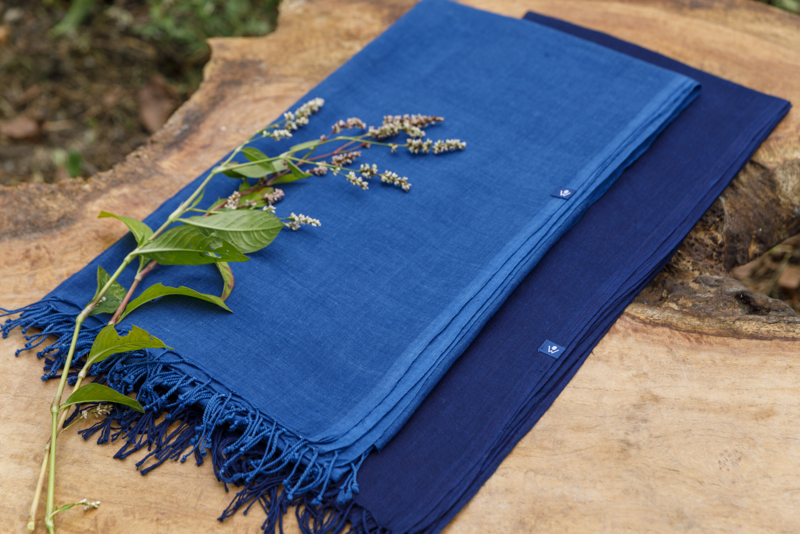 A blue fabric with fringes